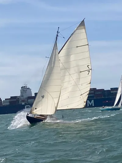 Classic wooden yacht under full sail on the Solent