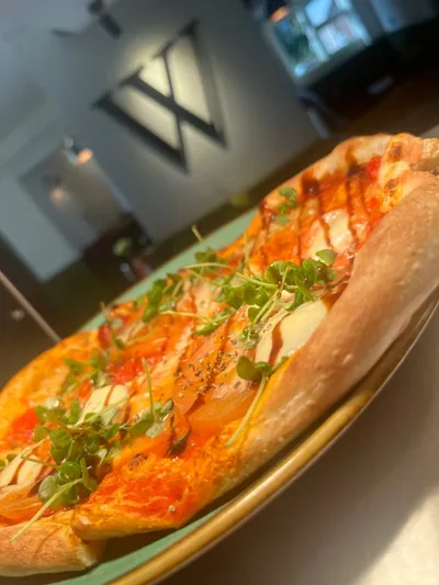 Stonebaked pizza served at Woodies
